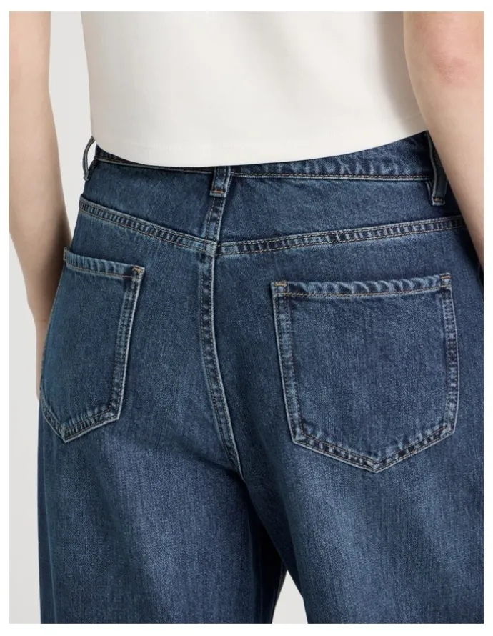 There After Mid Rise Distressed Wide Leg Jeans in Mid Blue