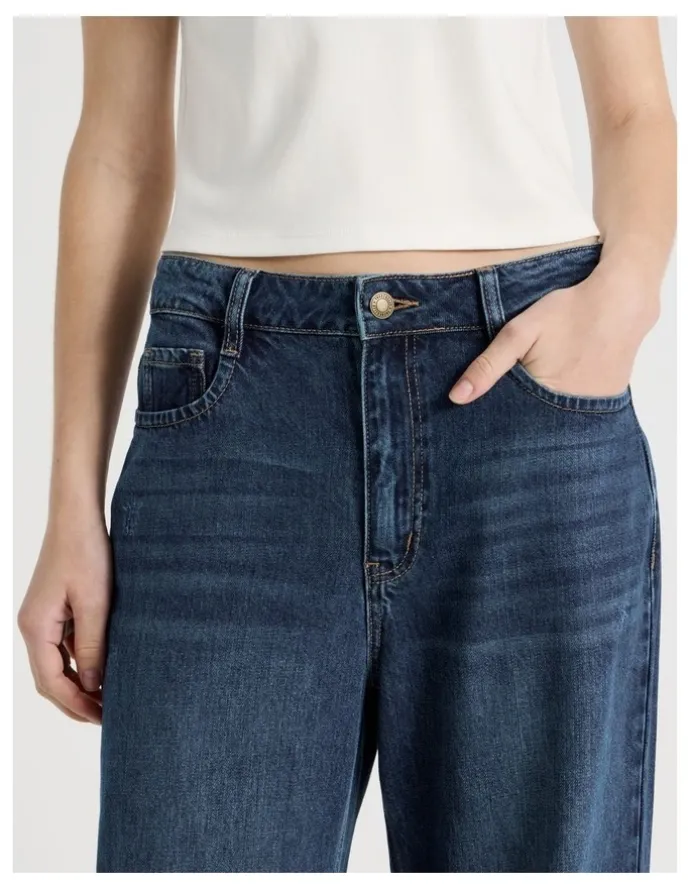 There After Mid Rise Distressed Wide Leg Jeans in Mid Blue