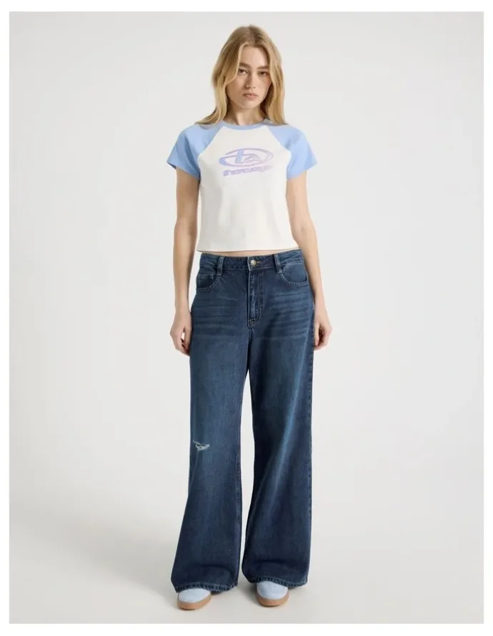 There After Mid Rise Distressed Wide Leg Jeans in Mid Blue